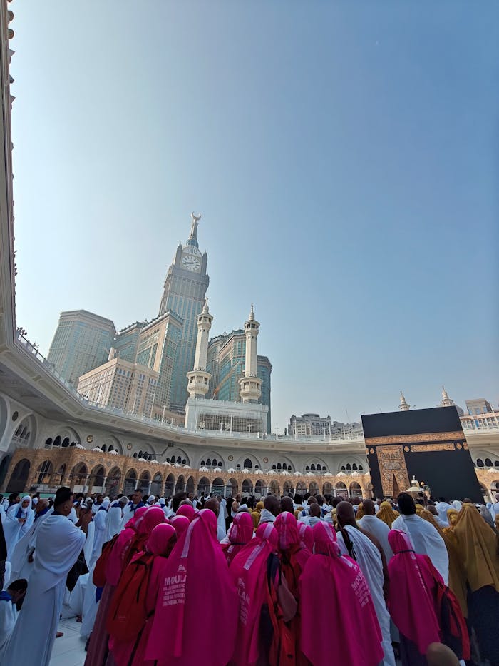 contact-img Crowd of pilgrims at the Grand Mosque in Mecca with the Kaaba and Abraj Al Bait Towers in view.